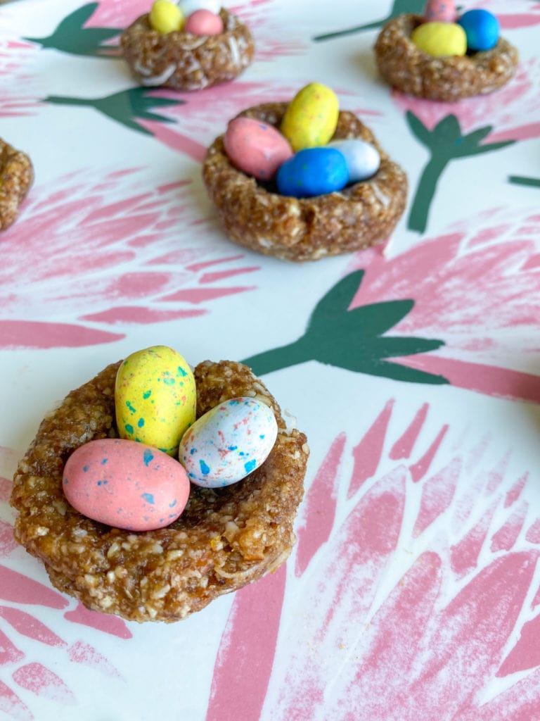 Close up of a few Easter bird's nests treats made with a paste of pitted dates, almonds and no added sugars.