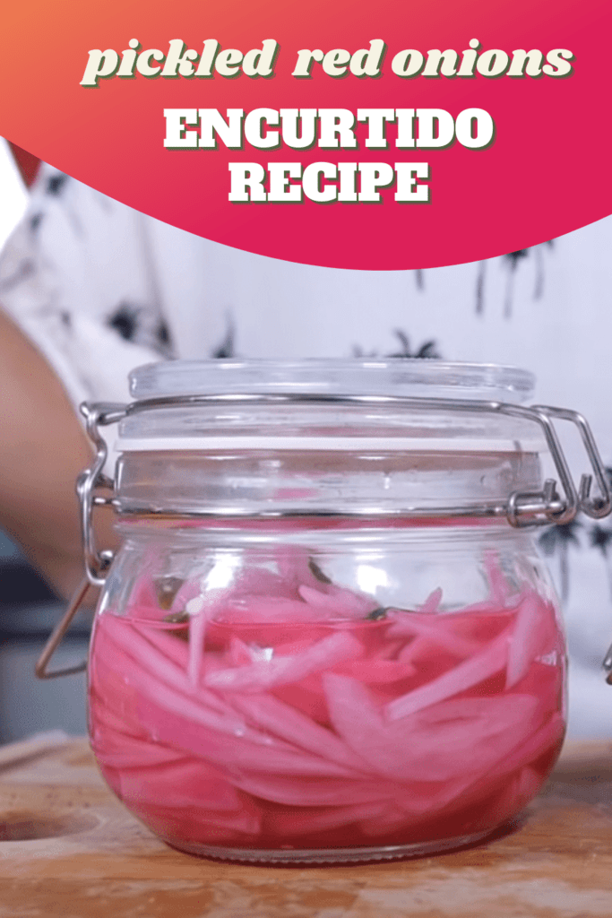 Pickled red onions encurtido inside a glass jar