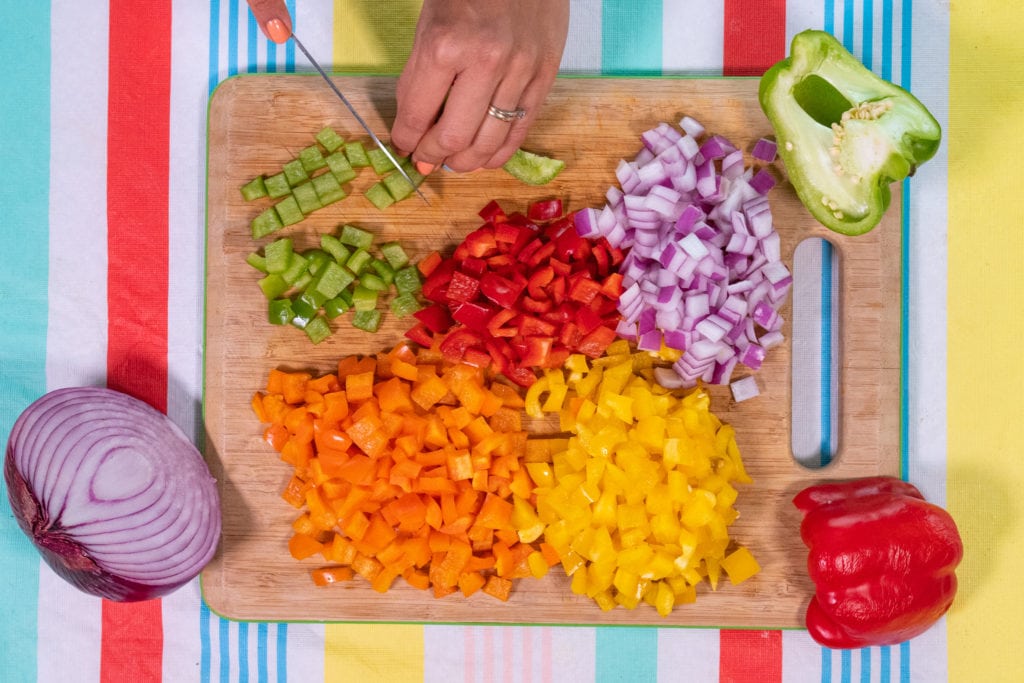 Rainbow colored veggie toppings chopped