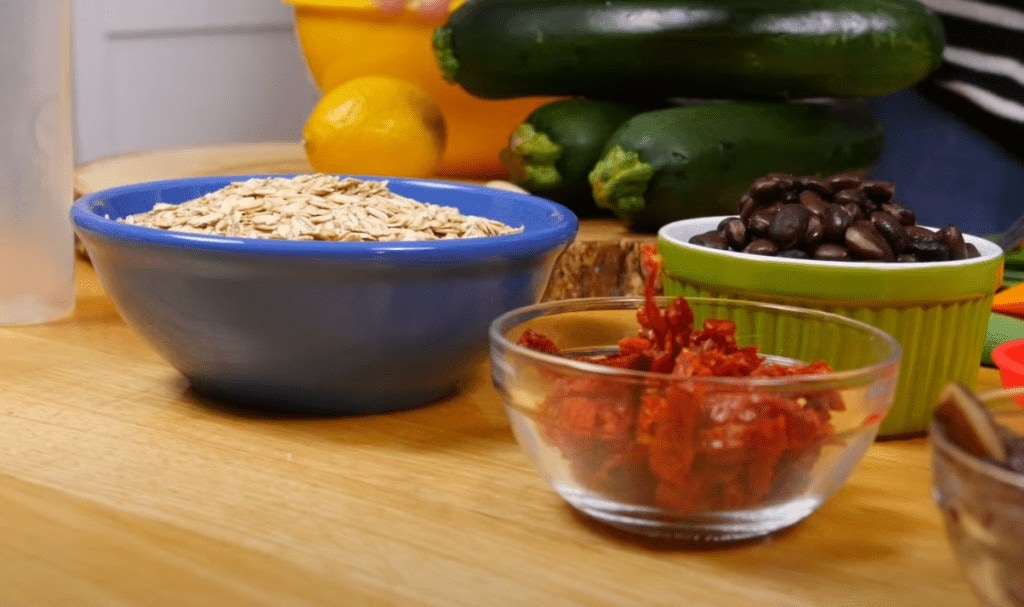 Rolled oats, sundried tomatoes, black beans, and zucchini are some of the healthy ingredients in this recipe.