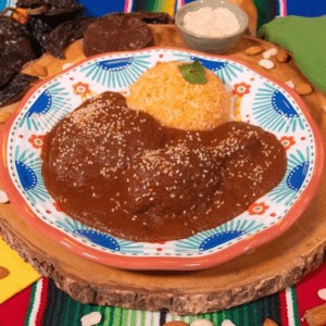 Mole poblano with chicken and rice served