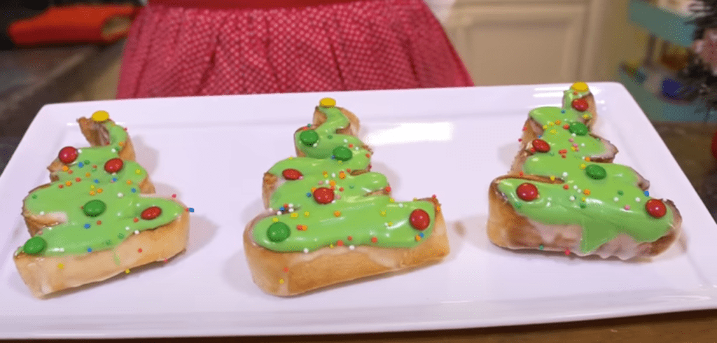 Cinnamon roll Christmas trees served on a white platter