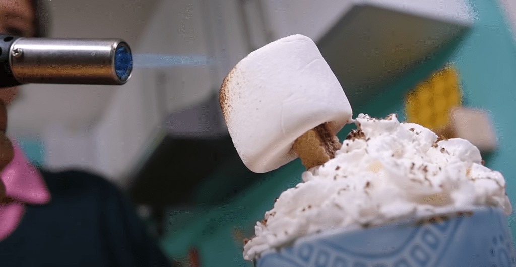 roasting a marshmallow with a kitchen torch