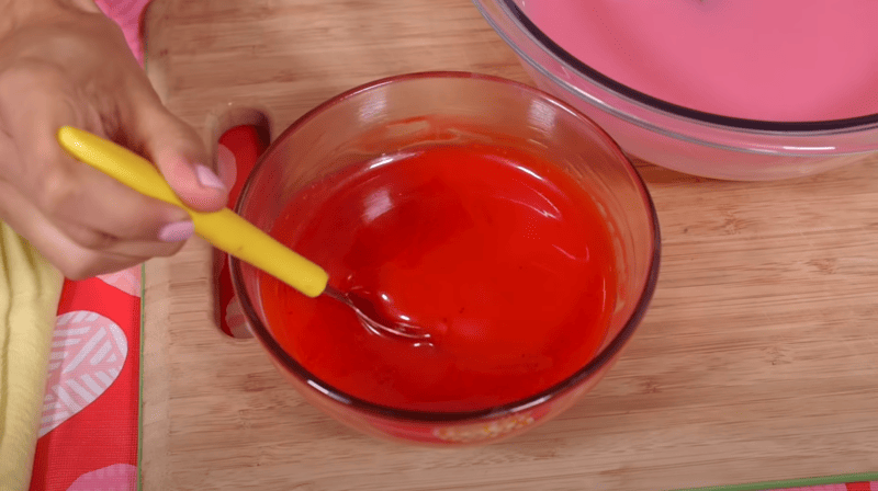 Add gel food coloring to mirror glaze