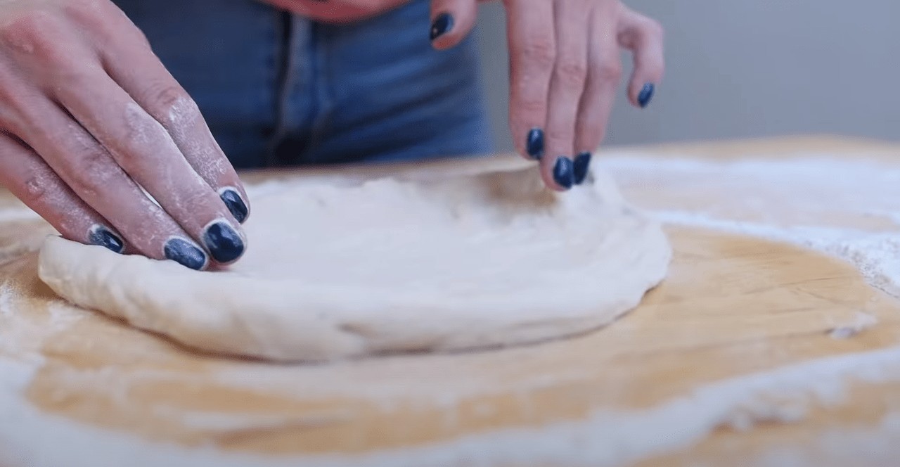 Press, rotate, and stretch the dough
