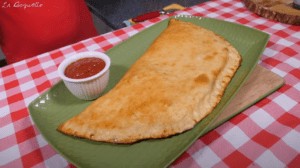 Italian style calzone with marinara sauce served separately